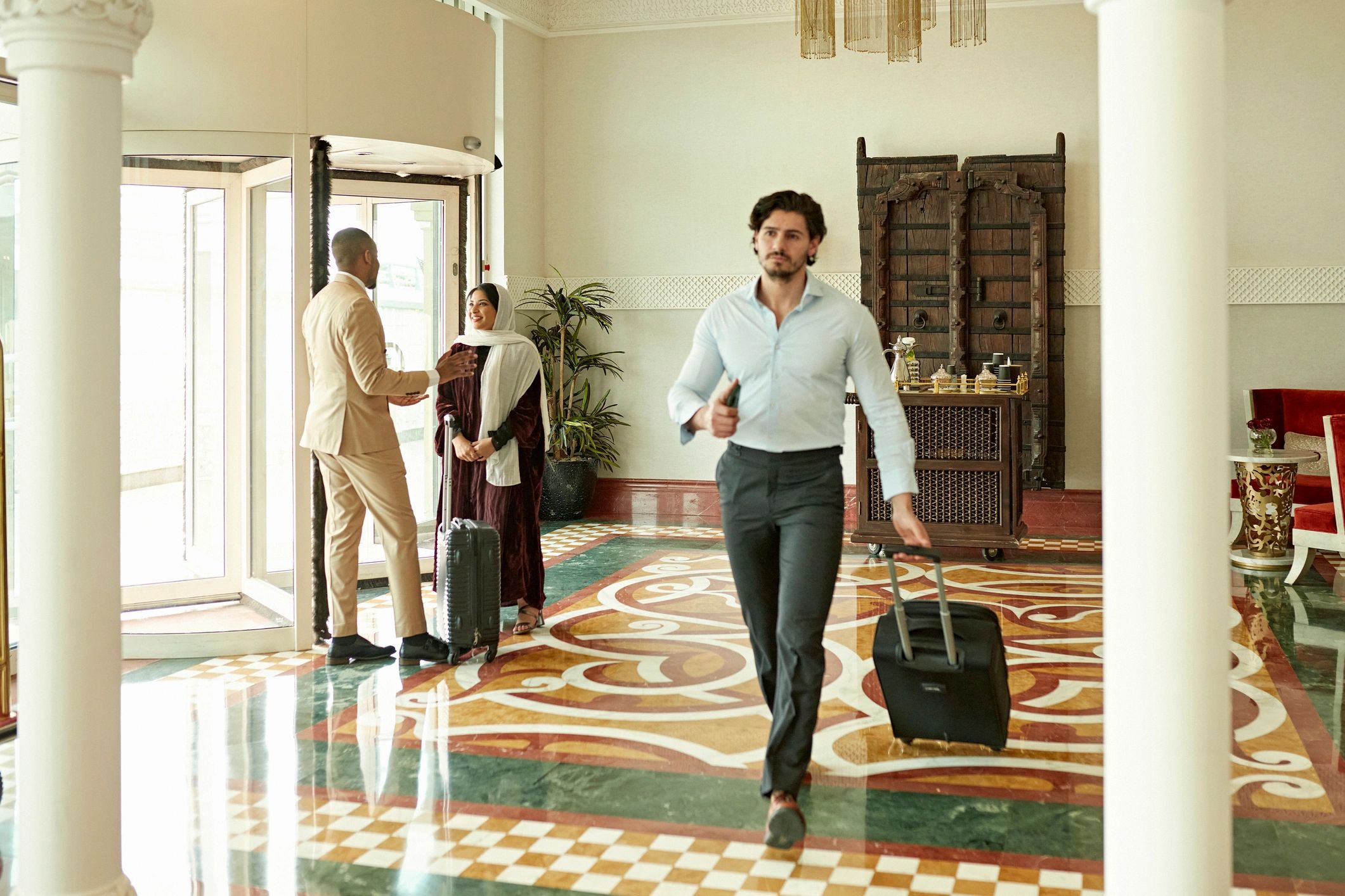 Traveler arriving at hotel entrance